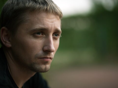 A young man looking ahead.